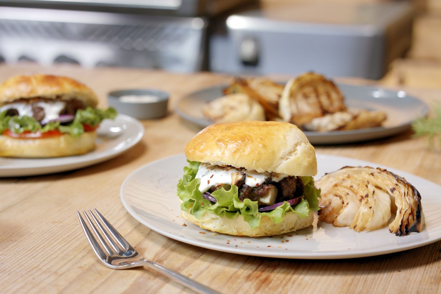 Burger with cheese and crispy onions and grilled cabbage
