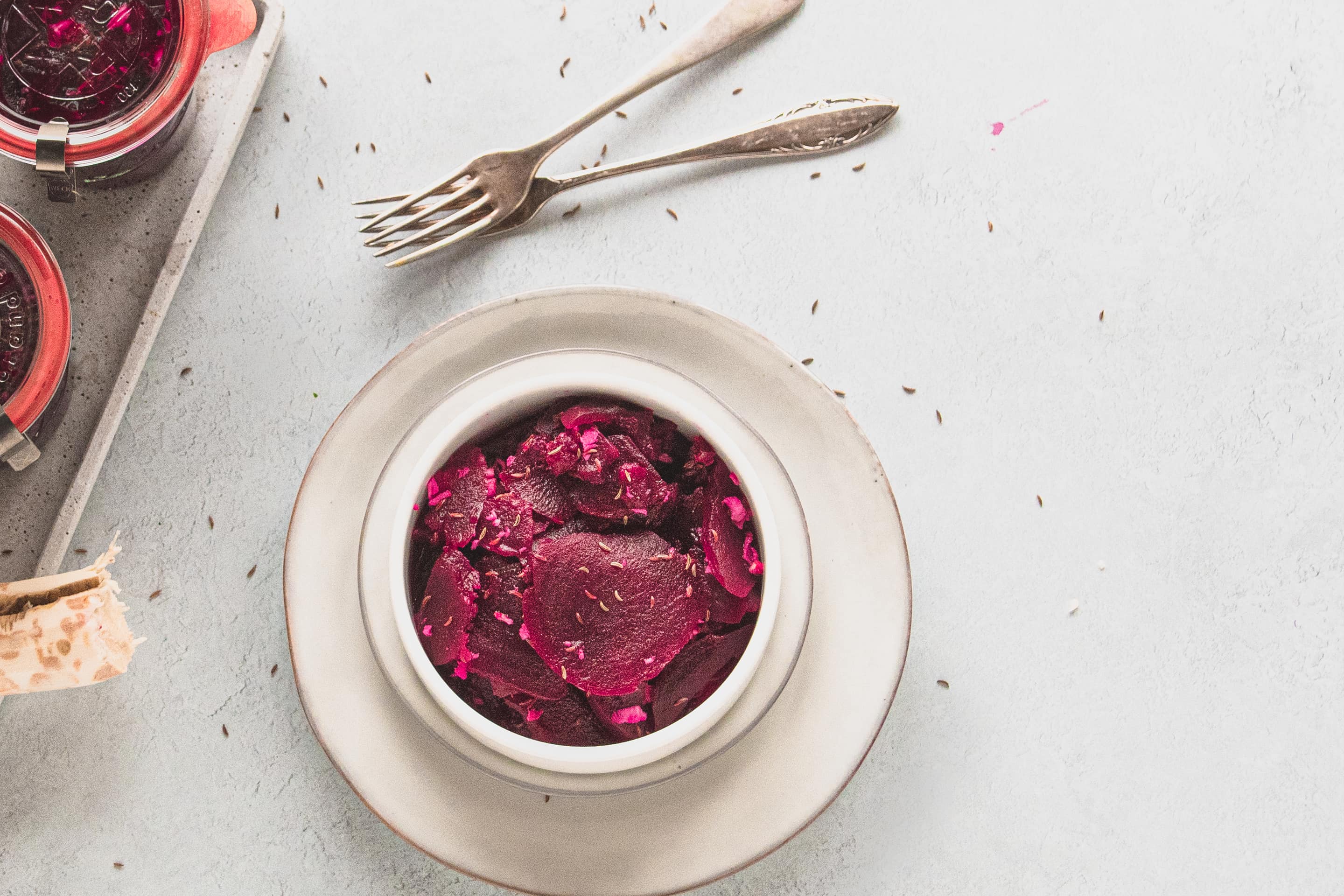 A portion of beet salad in a bowl.